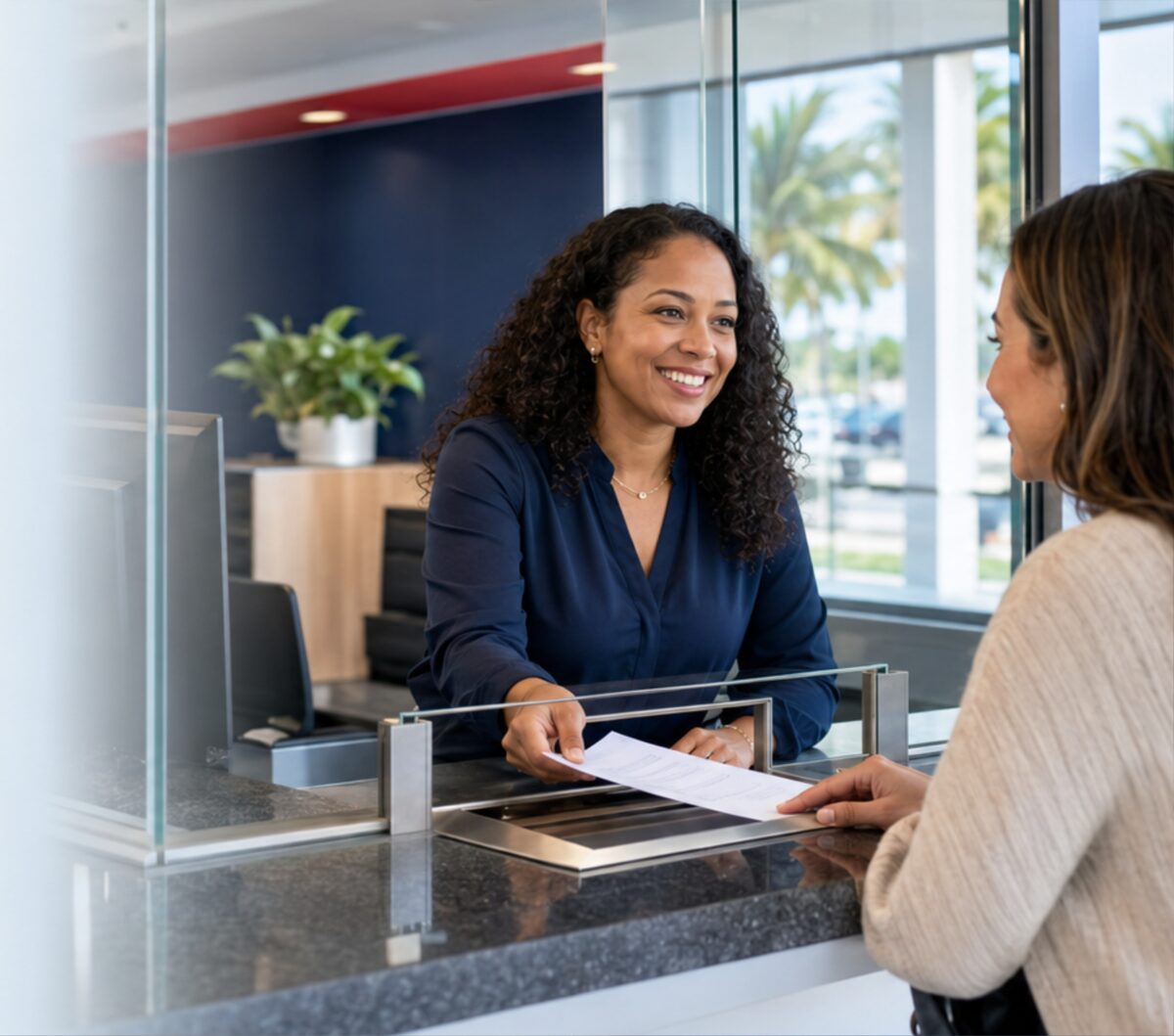 A Check Cashing USA associate serving a customer at the counter